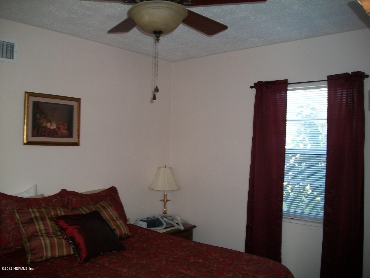 6038 Stetson Road Jacksonville, FL 32217 - Photo 44 of 55 a bedroom with a bed and a window