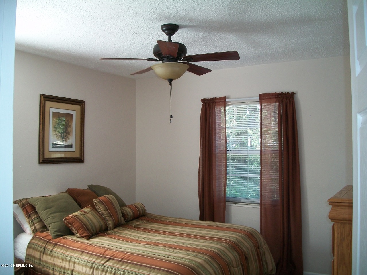 6038 Stetson Road Jacksonville, FL 32217 - Photo 45 of 55 a bedroom with a bed and a window