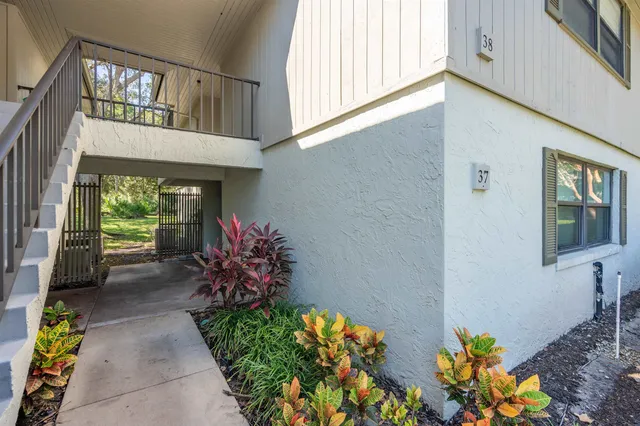 a front view of a house with outdoor seating