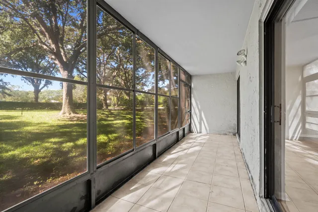 a view of a chair and table in backyard