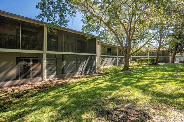 a view of outdoor space with large trees