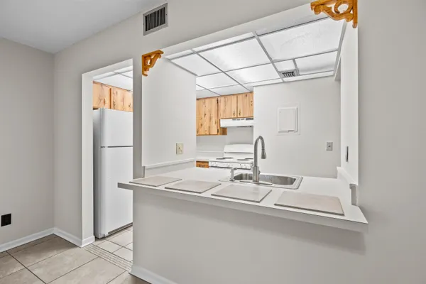 a kitchen with a stove and a sink