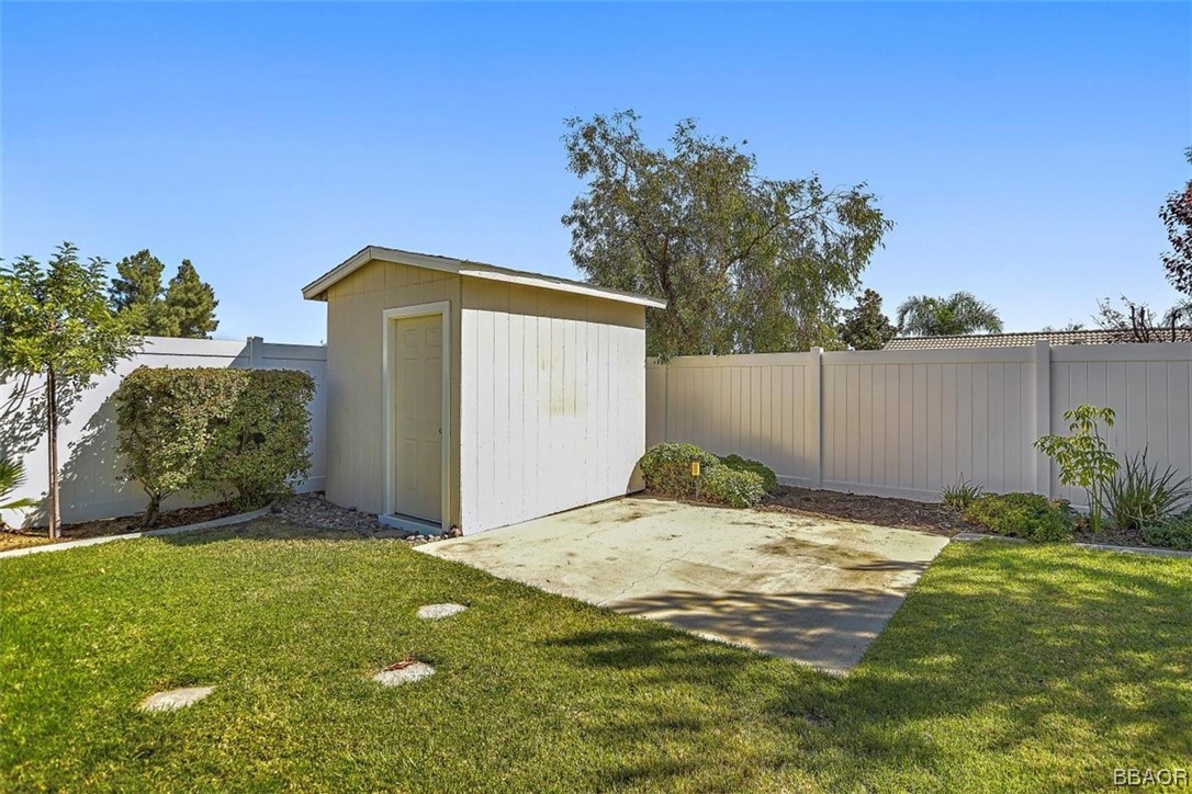 8476 Yarrow Lane Riverside, CA 92508 - Photo 23 of 27 a backyard of a house with plants and tree