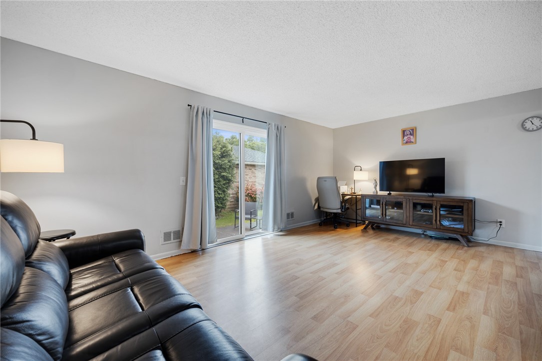 597 French Road Brighton, NY 14618 - Photo 9 of 24 Large living room will accommodate many different layouts.