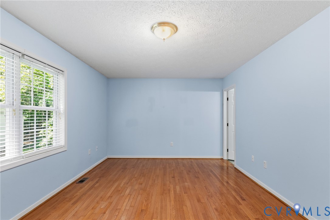 12654 Mt Olive Cohoke Road West Point, VA 23181 - Photo 17 of 31 a view of a room with wooden floor and window
