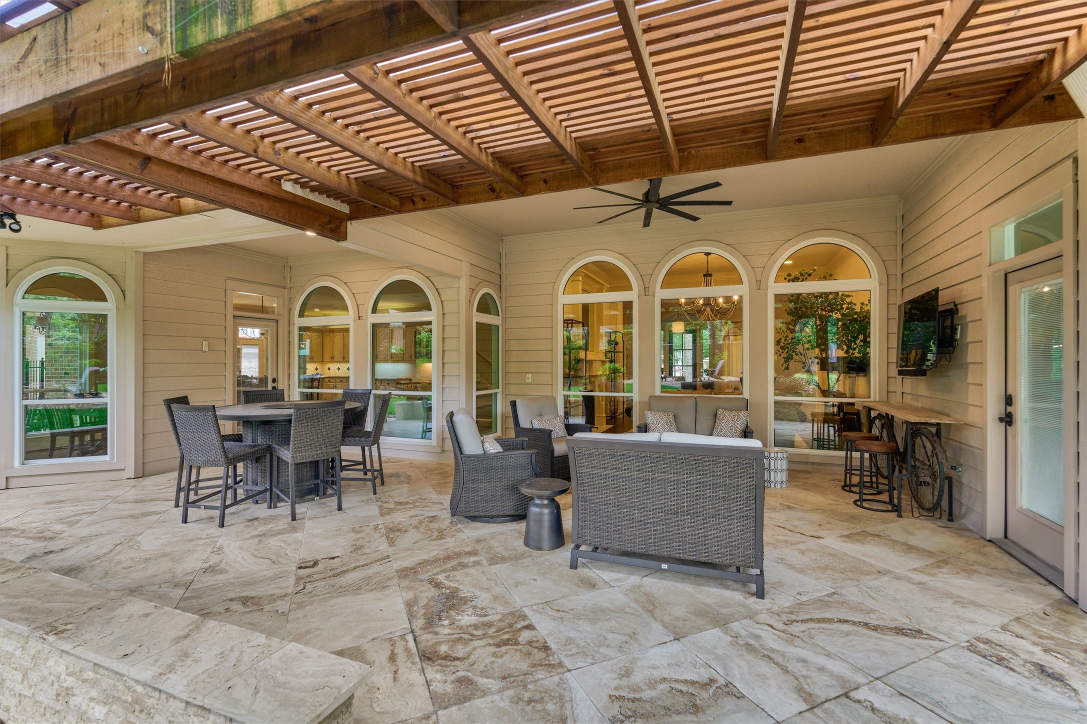 18 Treevine Court The Woodlands, TX 77381 - Photo 40 of 50 Enjoy year-round outdoor living under the covered veranda, with plenty of room for all your outdoor furniture and entertaining.