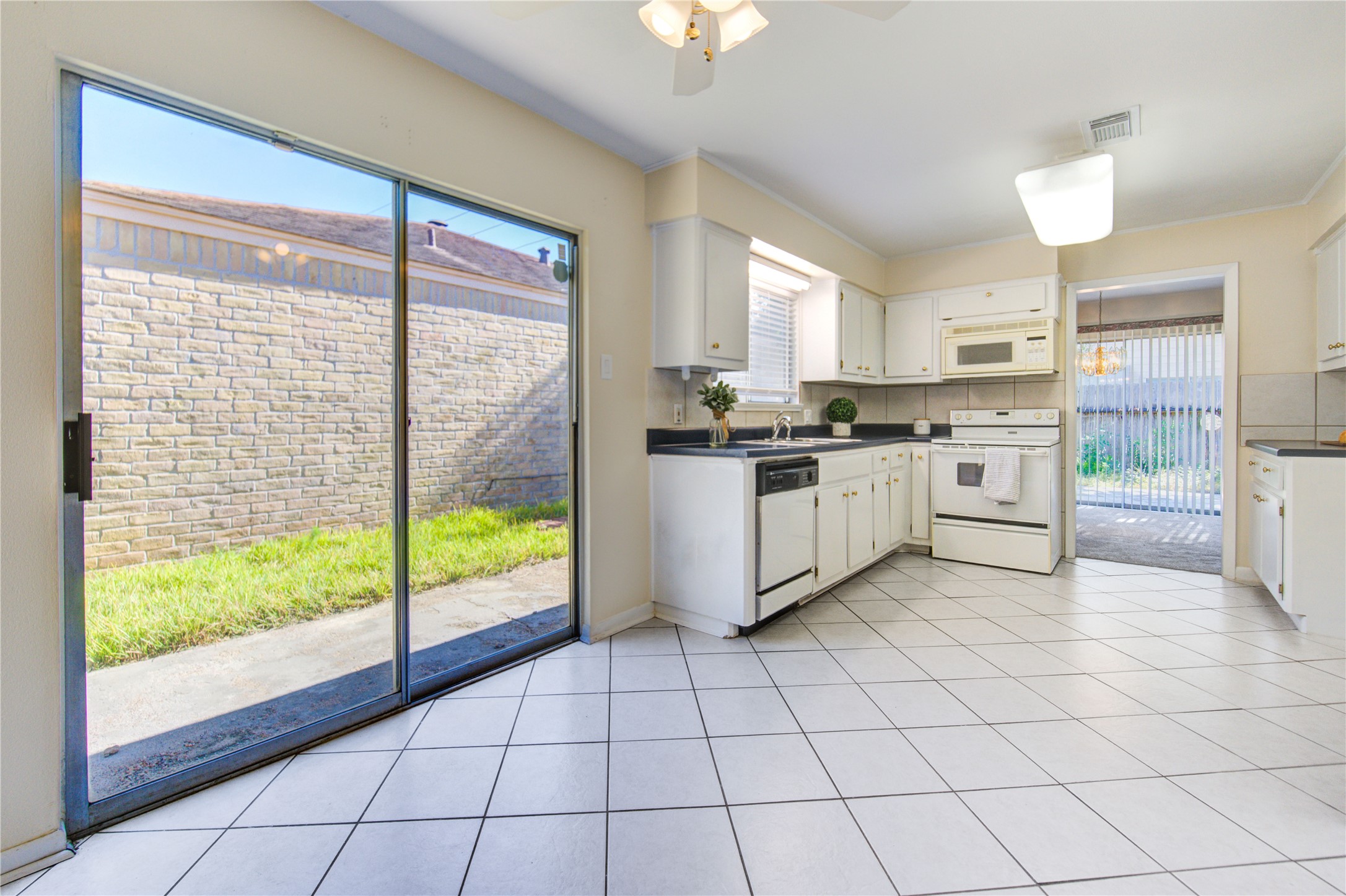1927 Ash Meadow Drive Houston, TX 77090 - Photo 11 of 50 a kitchen with stainless steel appliances a stove sink and cabinets