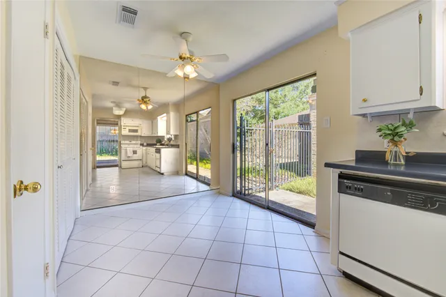 a view of a kitchen with a sink and a stove top oven