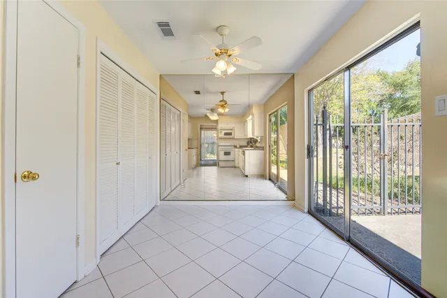 a view of a hallway with chandelier