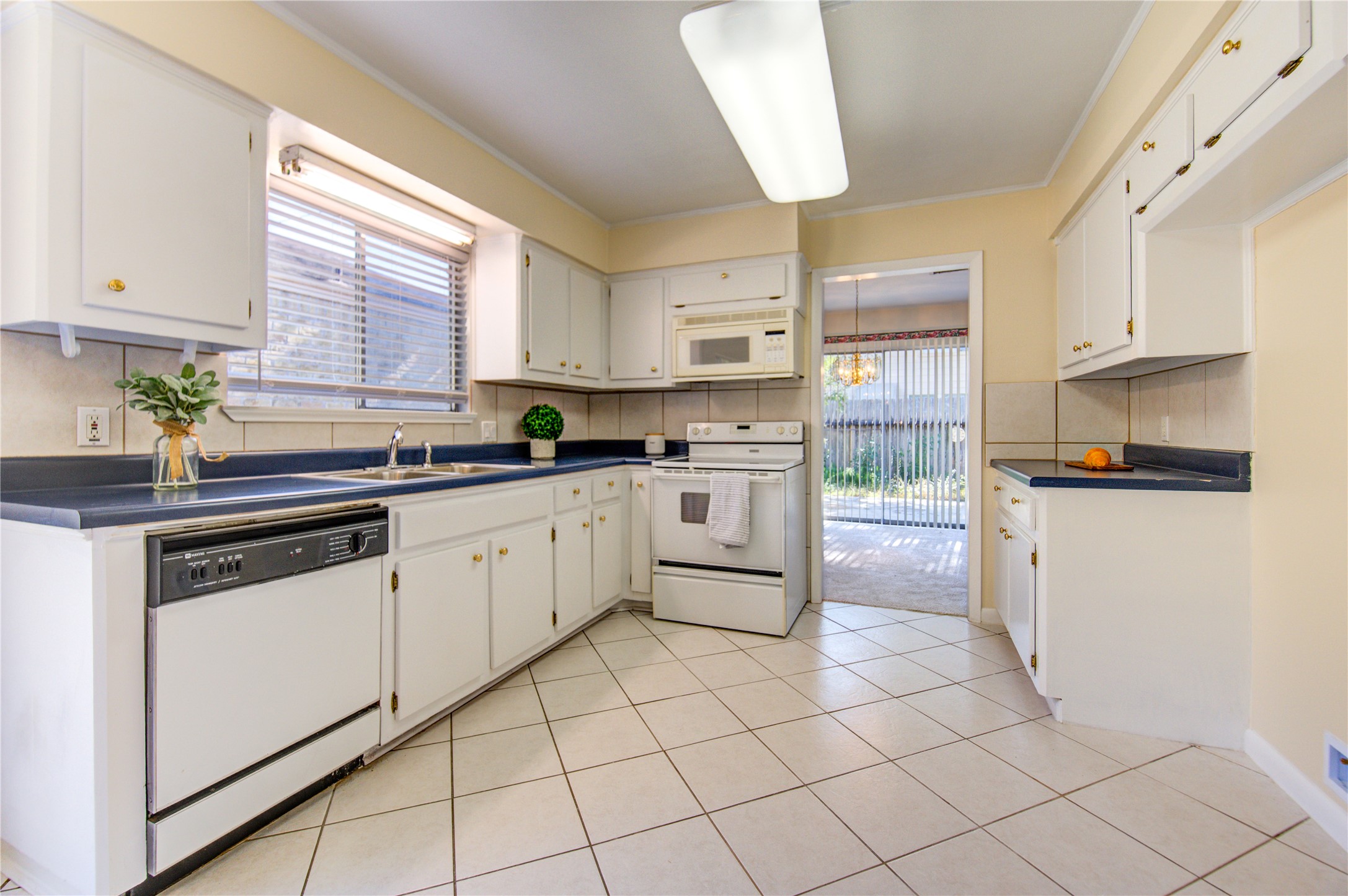 1927 Ash Meadow Drive Houston, TX 77090 - Photo 16 of 50 a kitchen with appliances cabinets and a sink