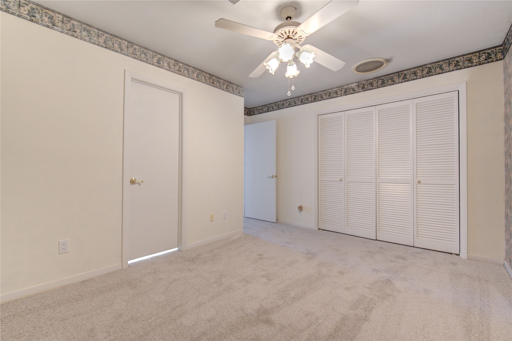 1927 Ash Meadow Drive Houston, TX 77090 - Photo 21 of 50 an empty room with chandelier fan