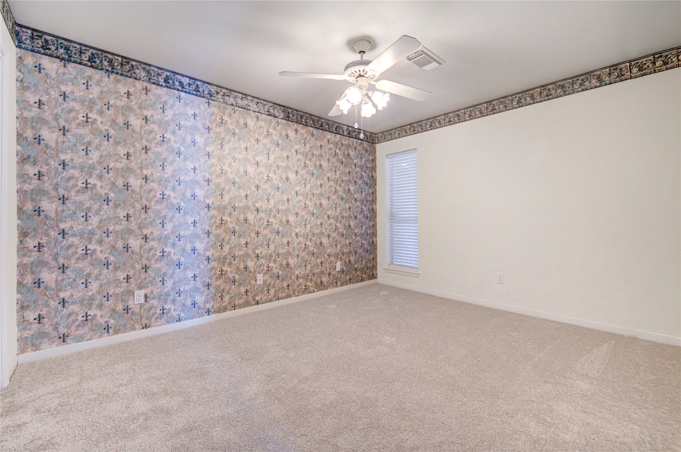 1927 Ash Meadow Drive Houston, TX 77090 - Photo 22 of 50 a view of a livingroom with a ceiling fan and window