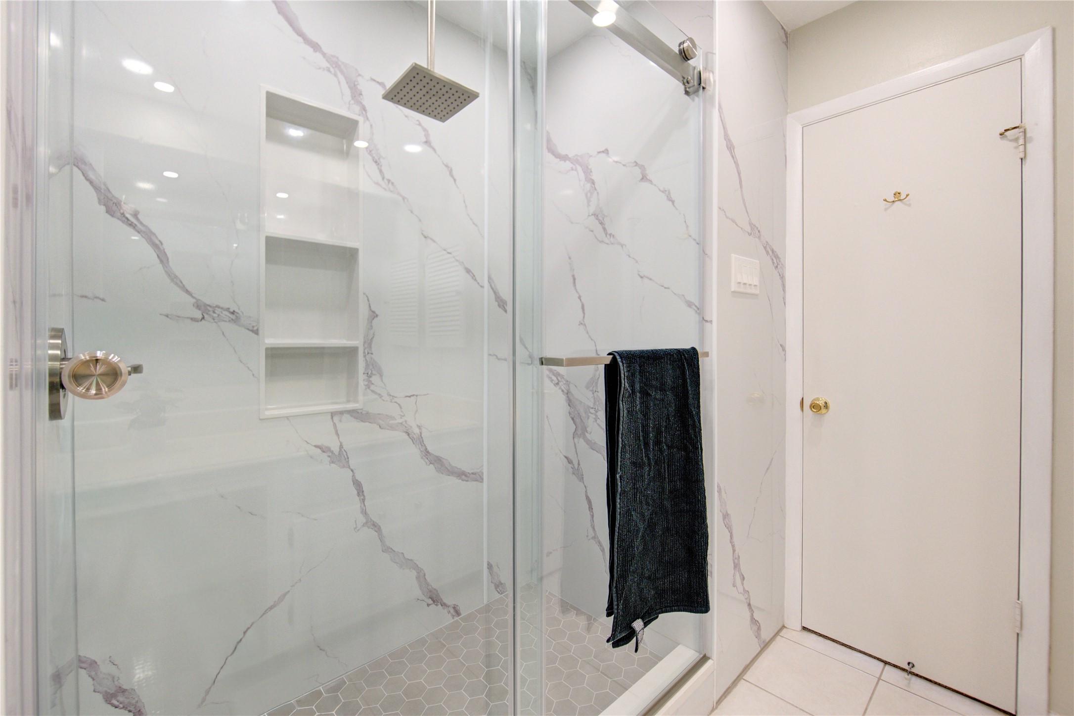 1927 Ash Meadow Drive Houston, TX 77090 - Photo 26 of 50 a bathroom with a shower and a glass door