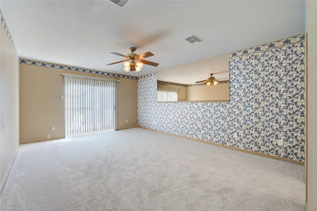 a view of an empty room with a bathroom