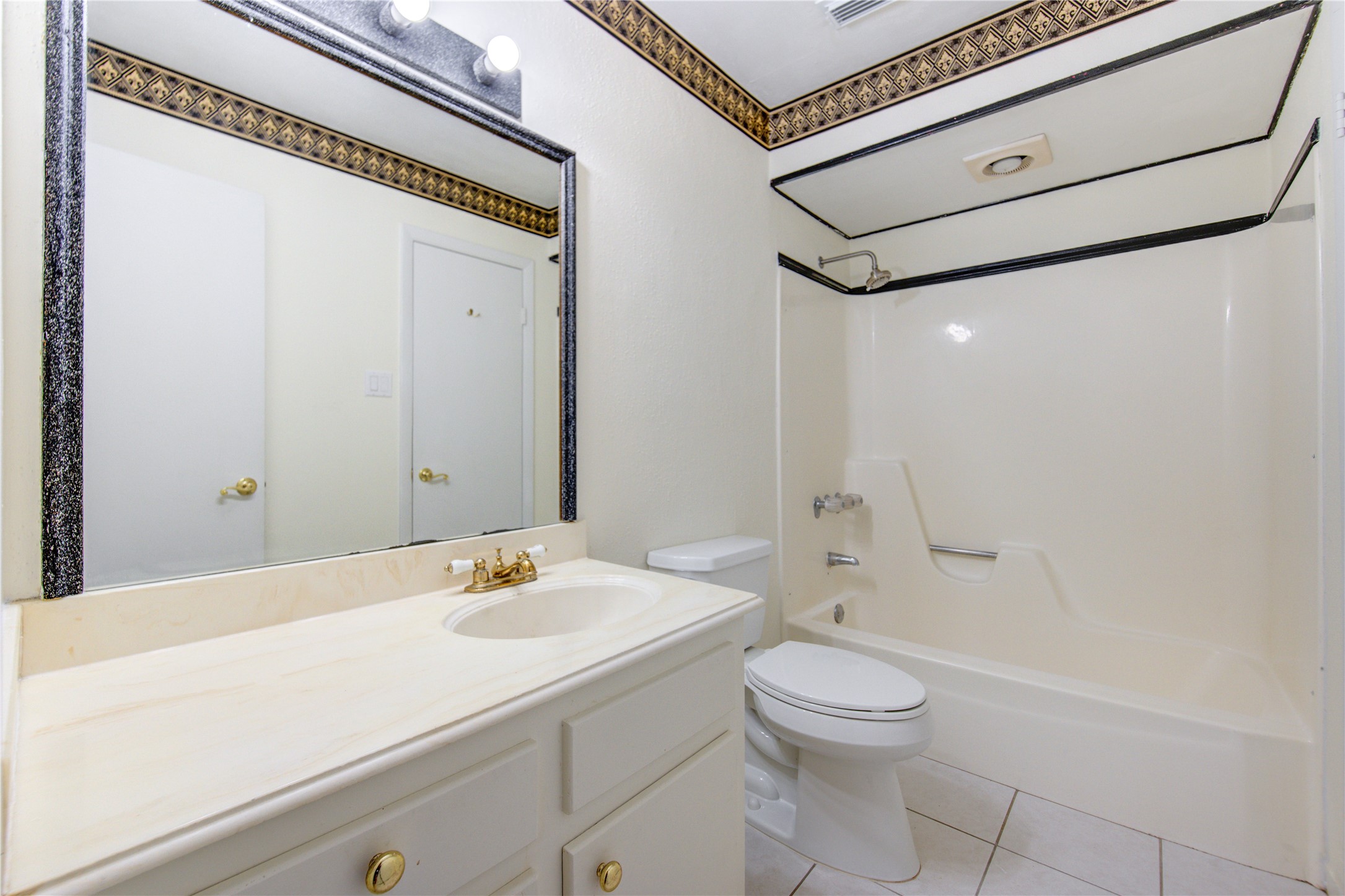 1927 Ash Meadow Drive Houston, TX 77090 - Photo 37 of 50 a bathroom with a sink a toilet and shower