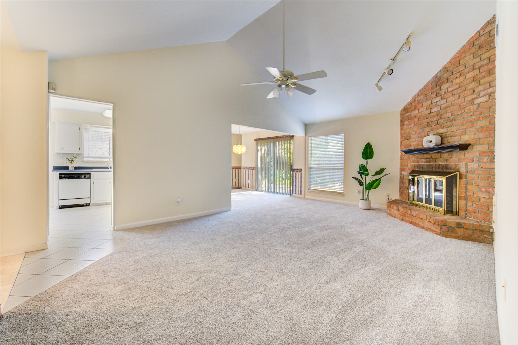 1927 Ash Meadow Drive Houston, TX 77090 - Photo 4 of 50 a view of an empty room with a fireplace and a window