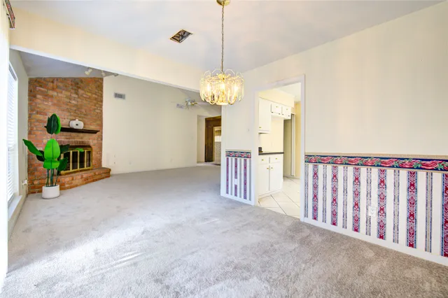 a view of a hallway with a chandelier