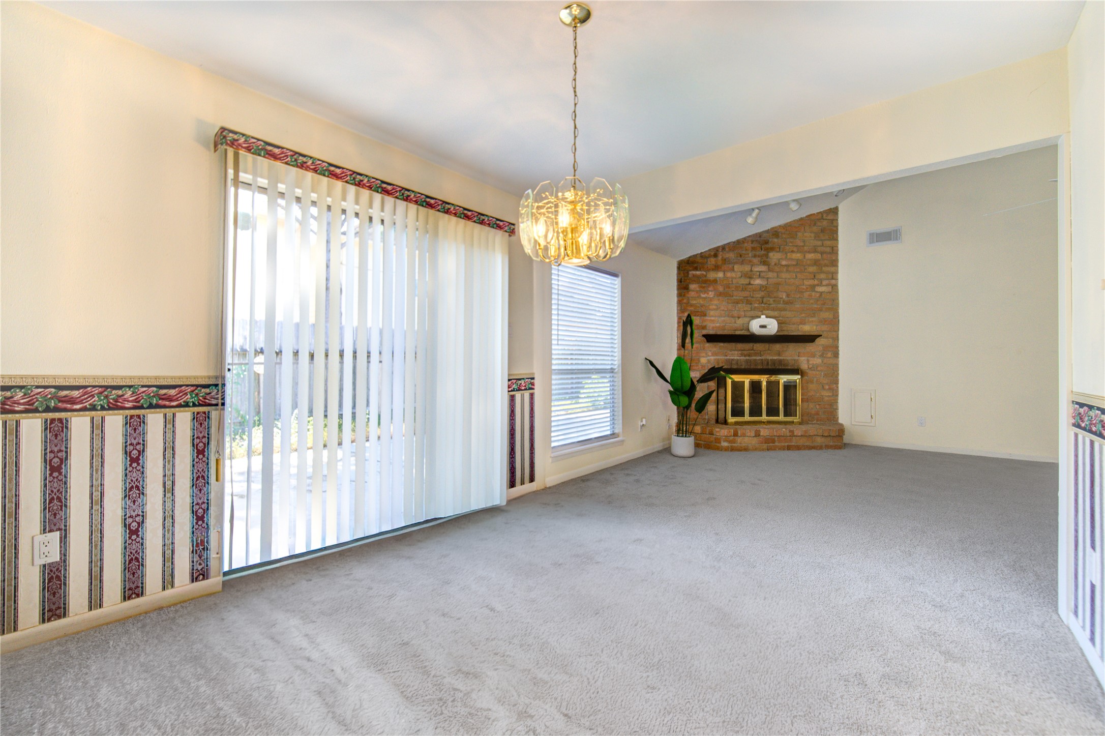 1927 Ash Meadow Drive Houston, TX 77090 - Photo 8 of 50 a view of a room with window chandelier fan