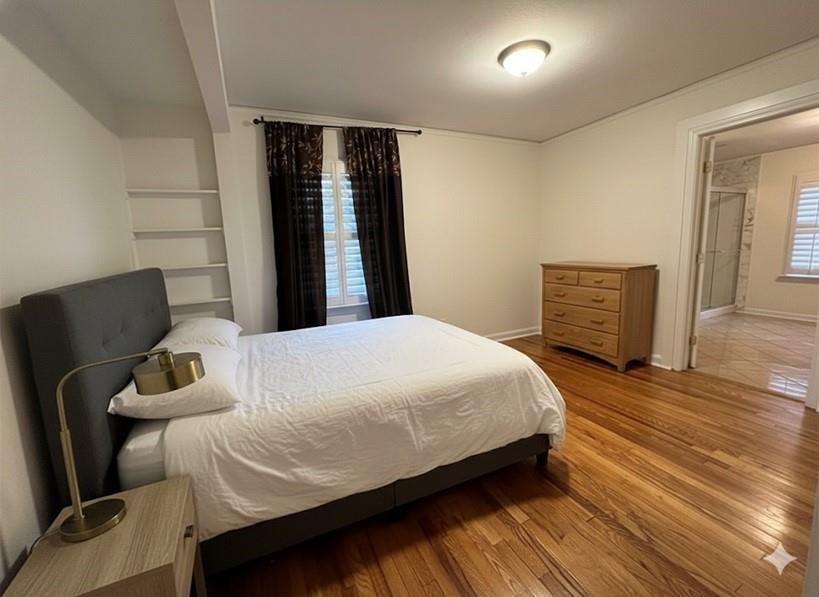 4641 Due W Road Northwest Kennesaw, GA 30152 - Photo 11 of 38 a bedroom with a bed and wooden floor