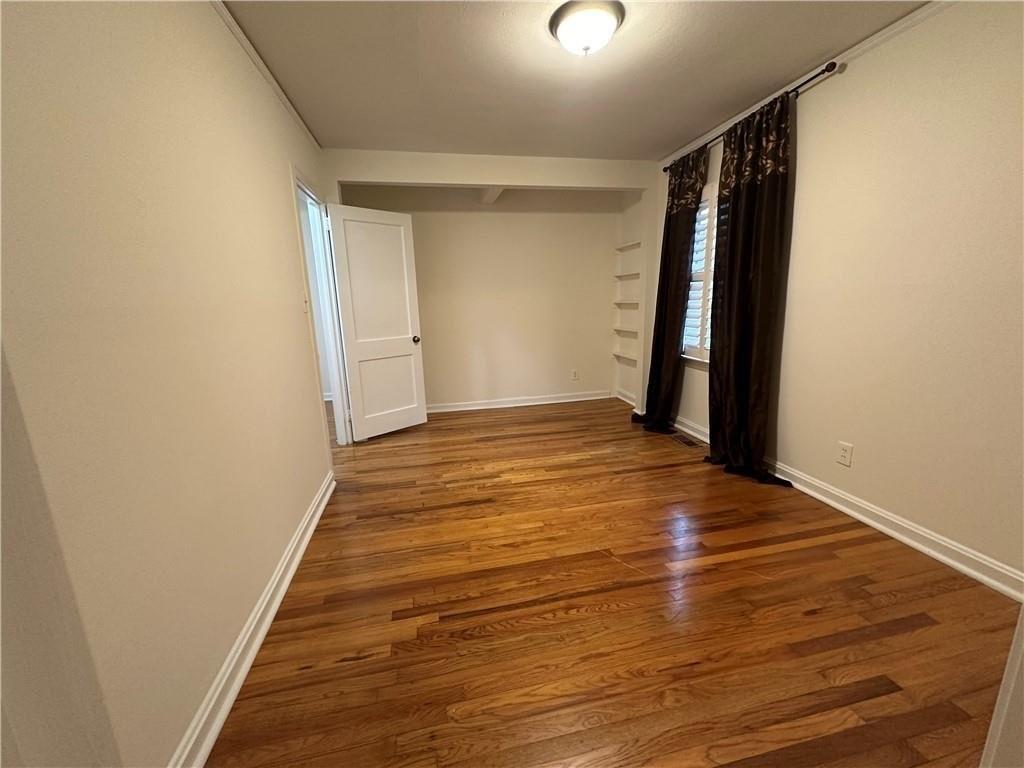 4641 Due W Road Northwest Kennesaw, GA 30152 - Photo 13 of 38 a view of a room with wooden floor and white walls