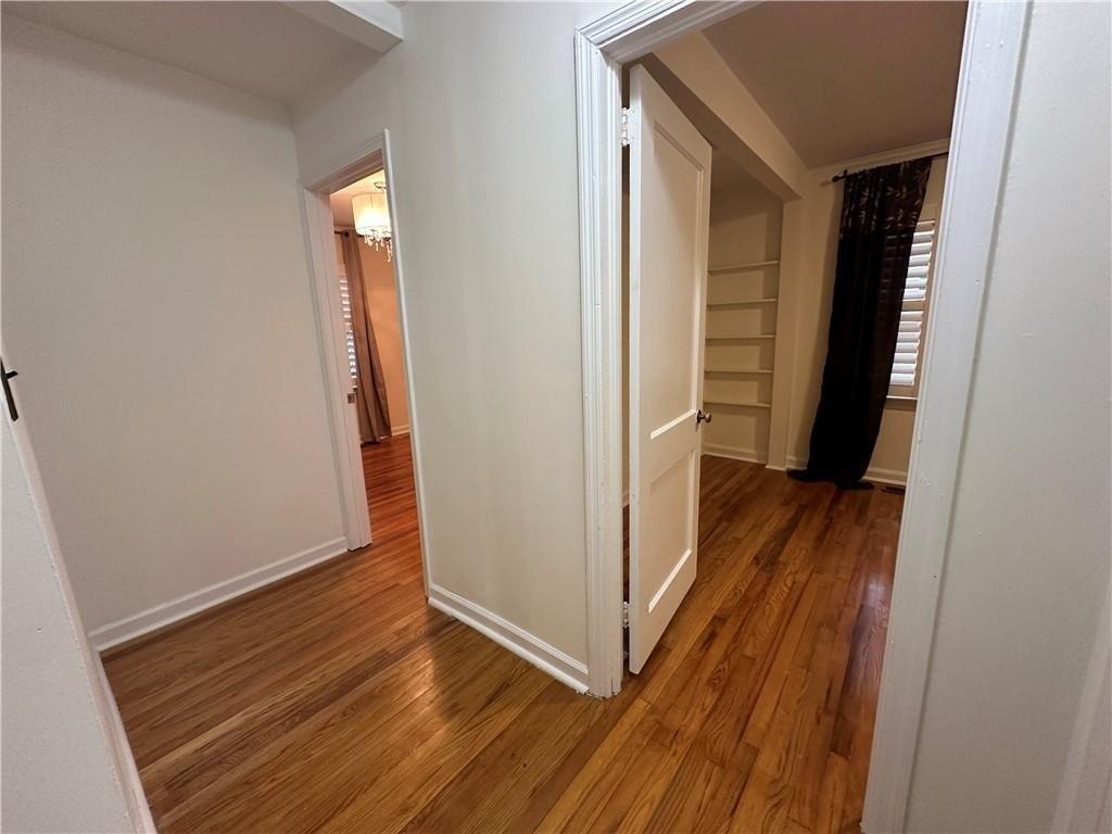 4641 Due W Road Northwest Kennesaw, GA 30152 - Photo 17 of 38 a view of a hallway with wooden floor and closet