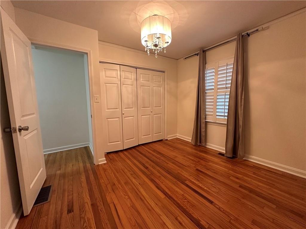 4641 Due W Road Northwest Kennesaw, GA 30152 - Photo 19 of 38 wooden floor in an empty room with a window