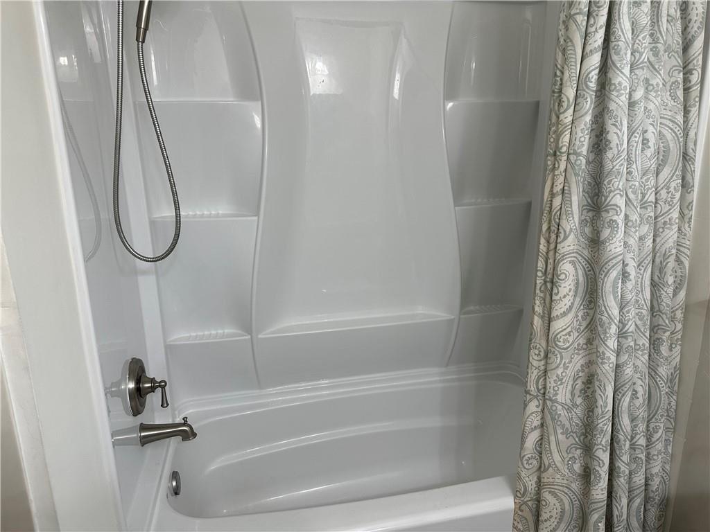 4641 Due W Road Northwest Kennesaw, GA 30152 - Photo 24 of 38 a bathroom with a bathtub