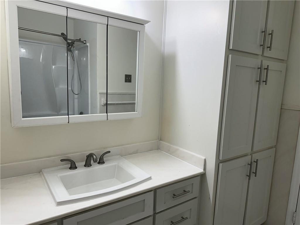 4641 Due W Road Northwest Kennesaw, GA 30152 - Photo 25 of 38 a bathroom with a sink and mirror