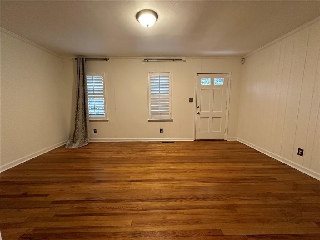 4641 Due W Road Northwest Kennesaw, GA 30152 - Photo 5 of 38 a view of an empty room with wooden floor and a window