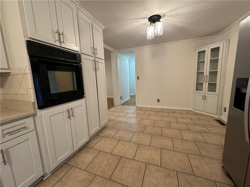 4641 Due W Road Northwest Kennesaw, GA 30152 - Photo 10 of 38 a view of a livingroom with an empty space and wooden floor