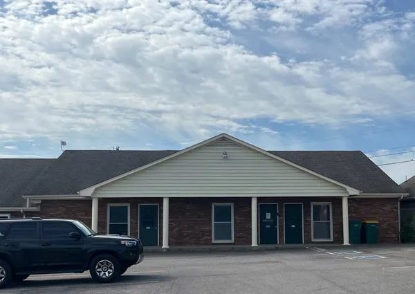 a car parked in front of a house