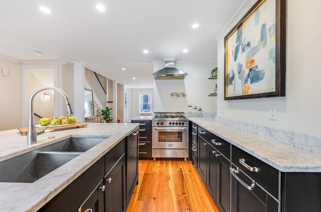 73 Gore Street Cambridge, MA 02141 - Photo 13 of 41 a kitchen with a sink stove and cabinets