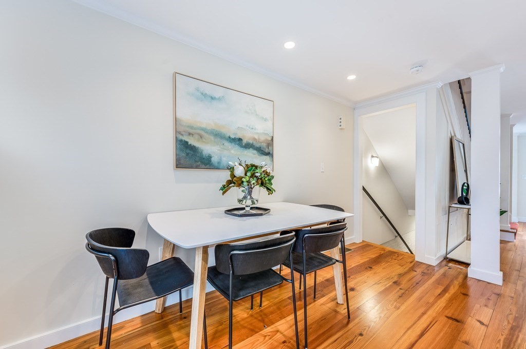 73 Gore Street Cambridge, MA 02141 - Photo 17 of 41 a view of a dining room with furniture and a potted plant