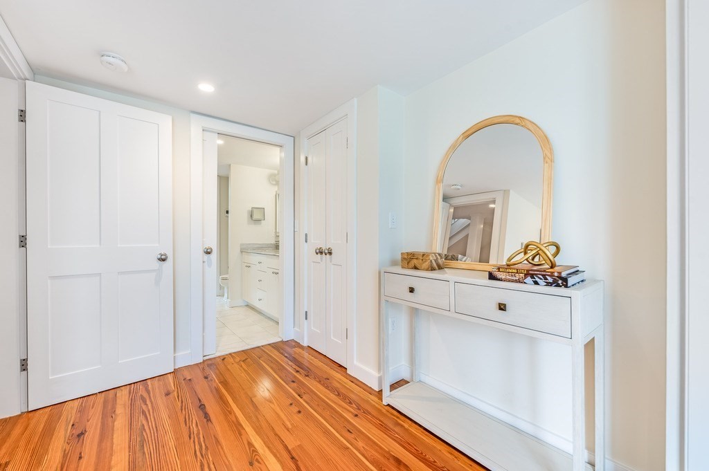 73 Gore Street Cambridge, MA 02141 - Photo 22 of 41 a room that has a bed and a dresser in it