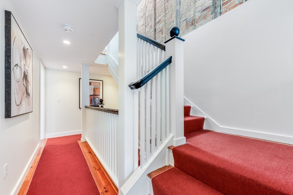73 Gore Street Cambridge, MA 02141 - Photo 28 of 41 a living room with furniture and stairs