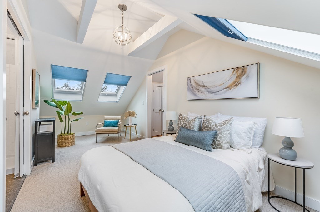 73 Gore Street Cambridge, MA 02141 - Photo 29 of 41 a bedroom with a bed a desk and chair