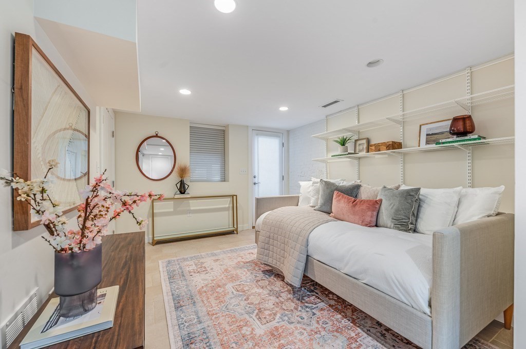 73 Gore Street Cambridge, MA 02141 - Photo 34 of 41 a living room with furniture and a mirror