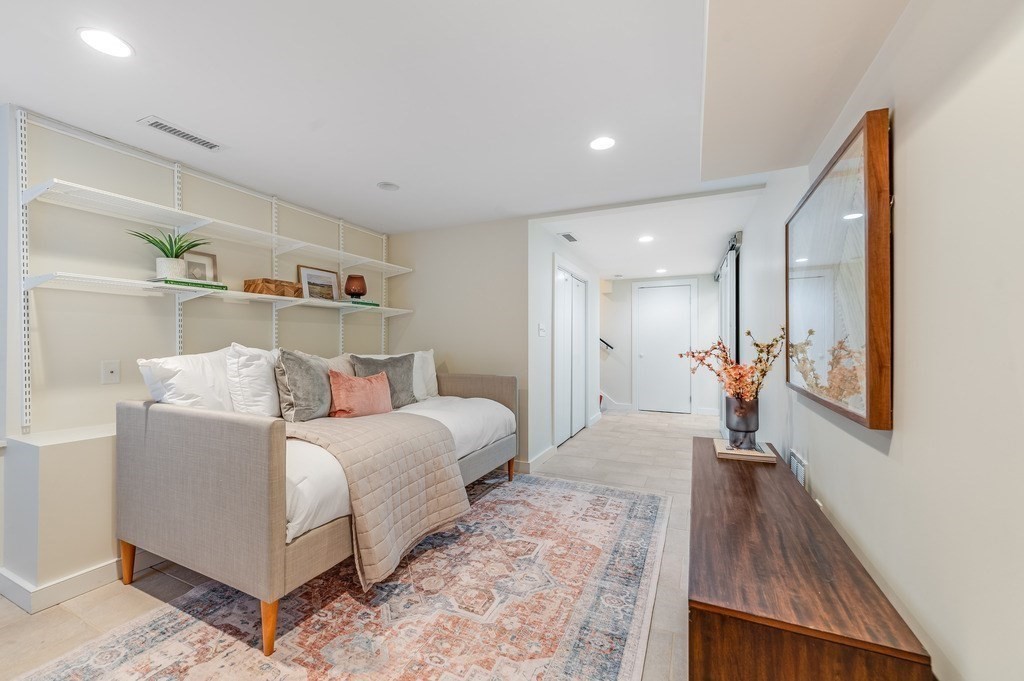 73 Gore Street Cambridge, MA 02141 - Photo 35 of 41 a bed room with a bed and a night stand