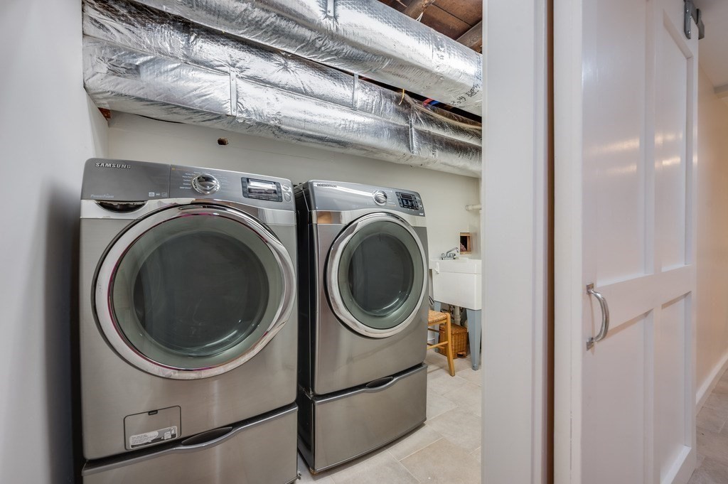 73 Gore Street Cambridge, MA 02141 - Photo 36 of 41 a close up view of a washer and dryer