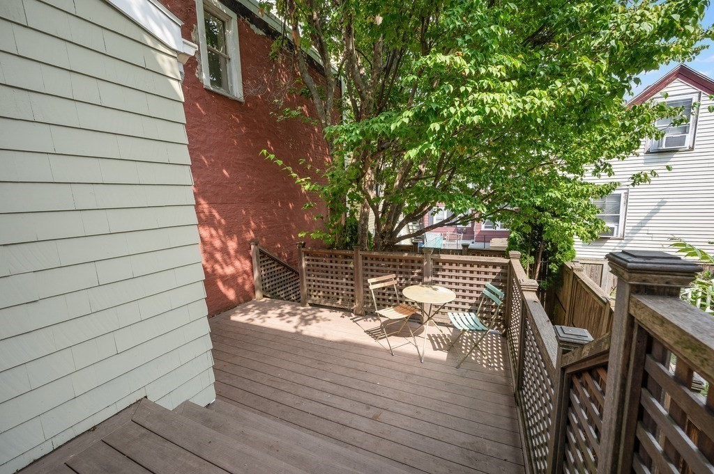 73 Gore Street Cambridge, MA 02141 - Photo 38 of 41 a view of balcony with wooden floor and outdoor seating
