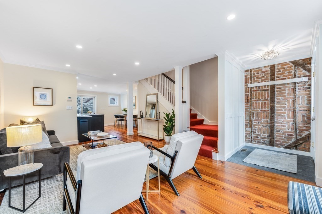 73 Gore Street Cambridge, MA 02141 - Photo 5 of 41 a living room with furniture and a wooden floor