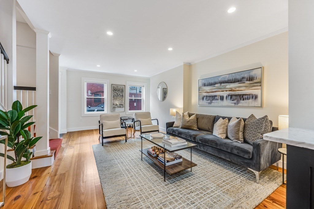 73 Gore Street Cambridge, MA 02141 - Photo 6 of 41 a living room with furniture and a large window