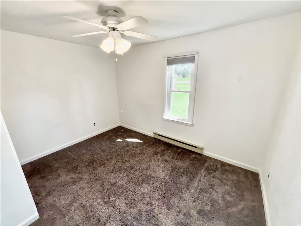 8411 Pitsburg-Laura Road Arcanum, OH 45304 - Photo 10 of 16 This cozy bedroom features plush carpeting and a large window offering natural light.