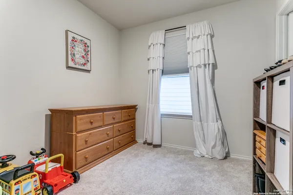 a room with toys and stairs