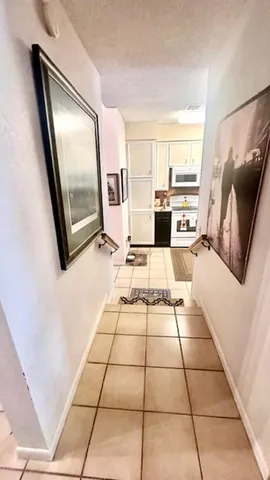 a view of living room with furniture and rug floor