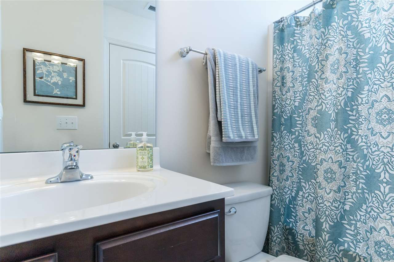 241 Spark Street Raleigh, NC 27606 - Photo 17 of 25 a bathroom with a sink and a mirror