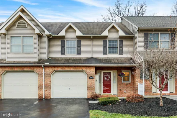 a front view of a house with garage