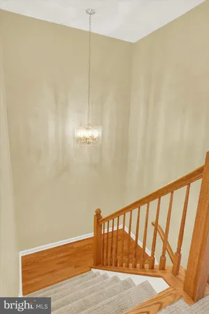 a view of a room with an empty space and a window