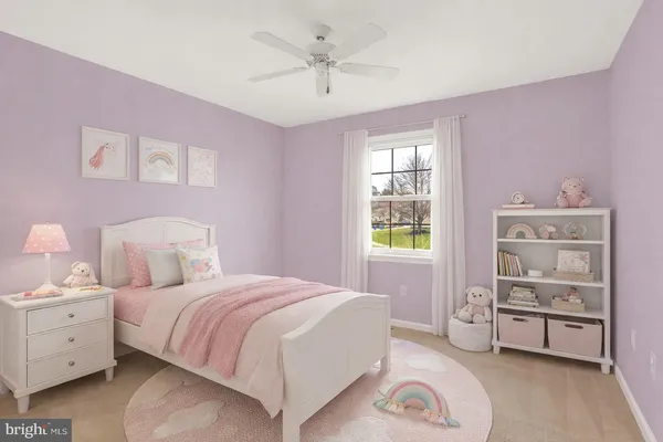 a spacious bedroom with a bed and a cabinets