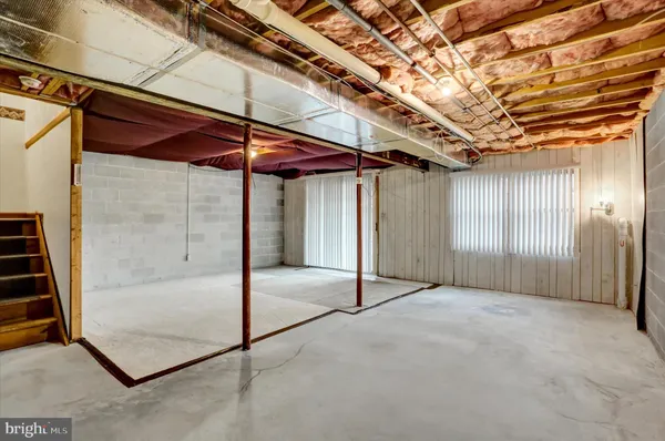 a view of a room with wooden walls